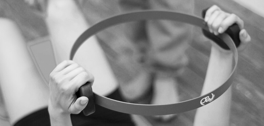 The Pilates ring, used in my sessions, helps build stronger muscles by increasing resistance, improves balance by focusing on core strength, and enhances heart health by making the heart muscles work harder.